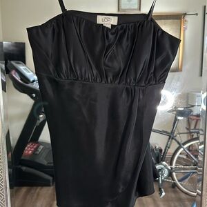 100% Silk strapless cami.  But can be worn with straps.